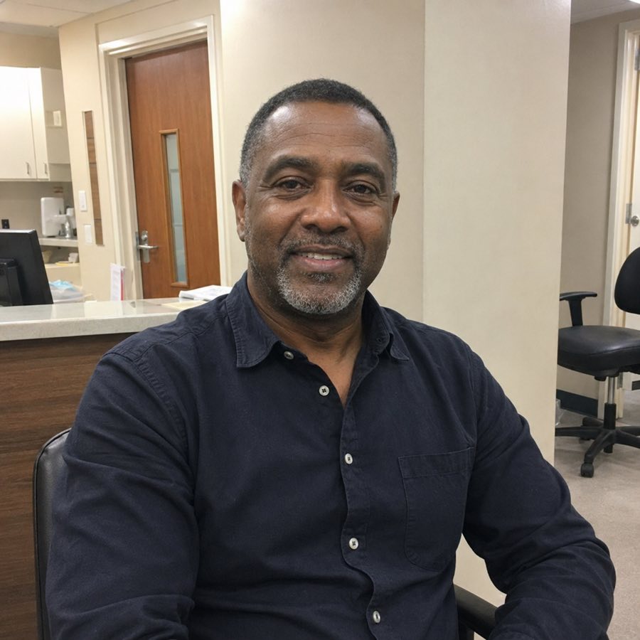 Smiling portrait of Dr. Kwame Mensah